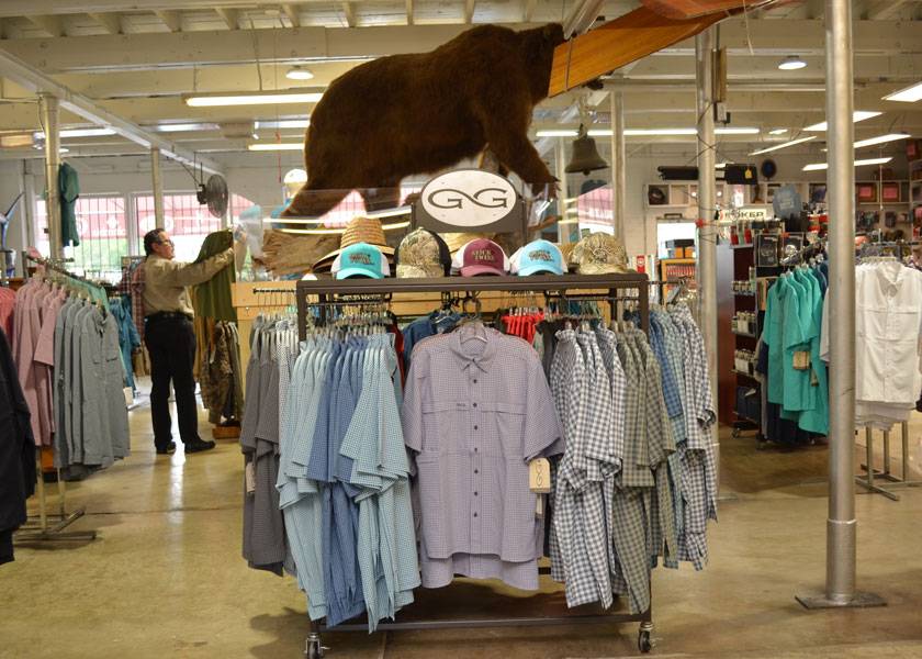 Glick-Twins-Gameguard-Outdoors-Shirts-on-Rack-with-Stuffed-Bear-in-Background